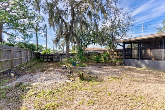 view of yard featuring a sunroom