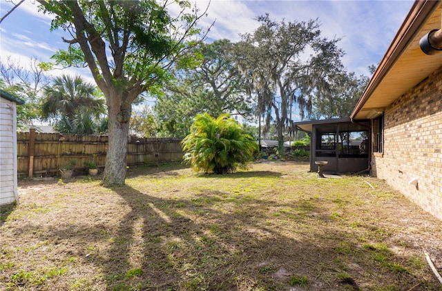 view of yard featuring a sunroom