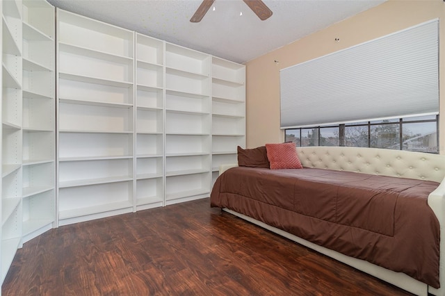 bedroom with ceiling fan and hardwood / wood-style flooring