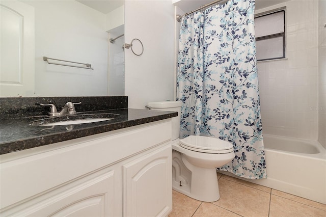 full bathroom featuring toilet, vanity, tile patterned floors, and shower / tub combo with curtain