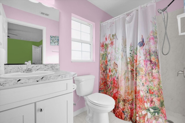 bathroom with vanity, tile patterned flooring, ceiling fan, toilet, and curtained shower