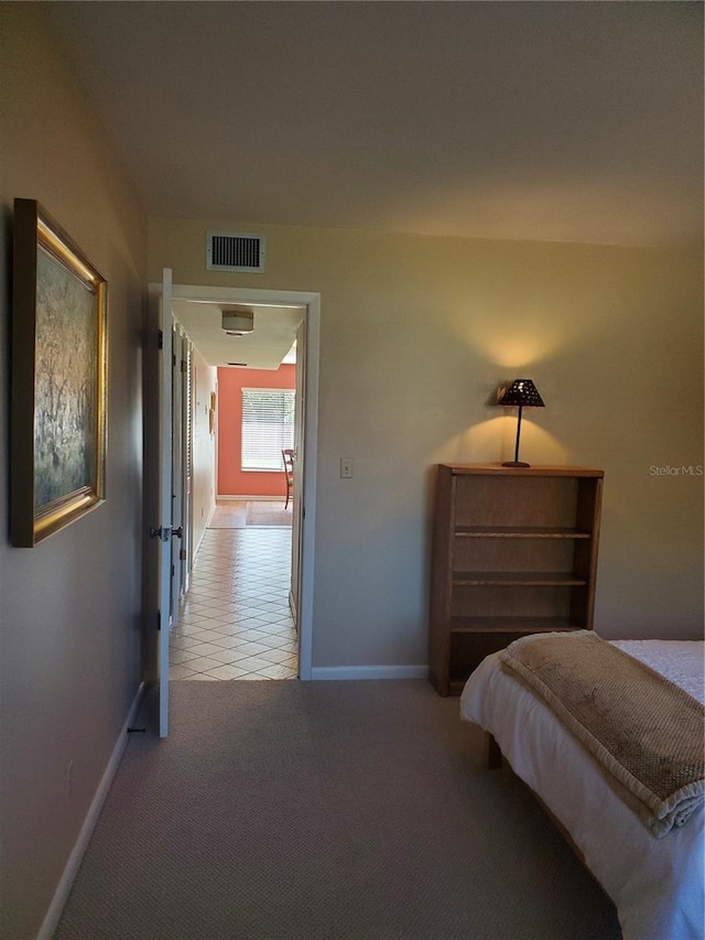 unfurnished bedroom featuring light carpet