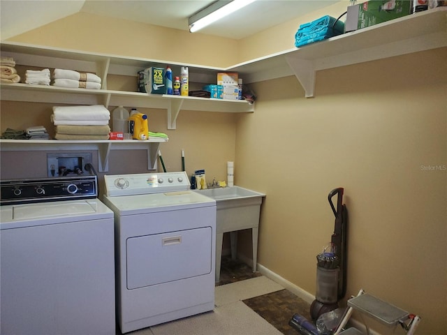 clothes washing area featuring washer and dryer