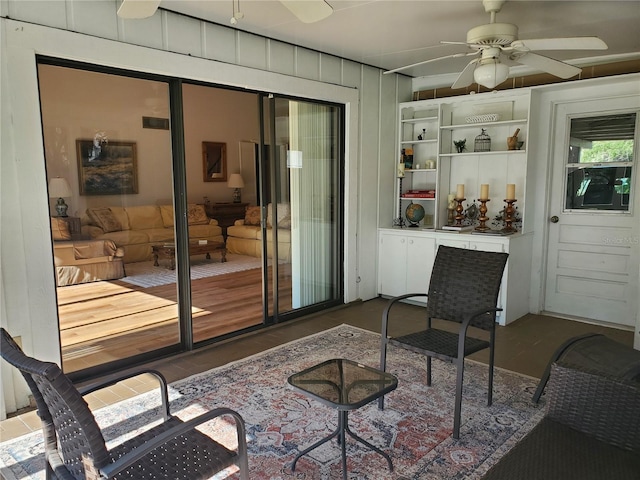 doorway featuring ceiling fan