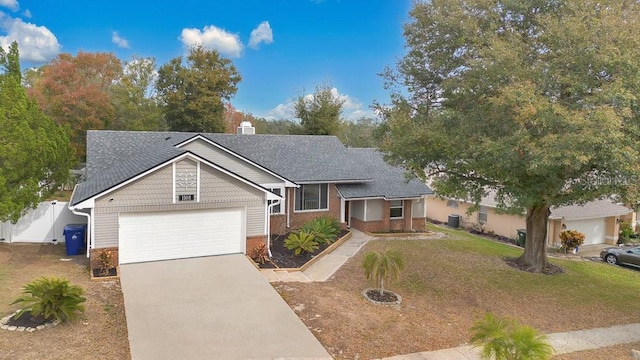 ranch-style house featuring a garage and a front yard