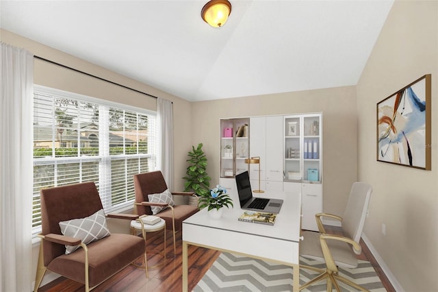 office featuring hardwood / wood-style floors and vaulted ceiling