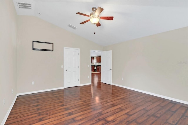 spare room featuring lofted ceiling, ceiling fan, and dark hardwood / wood-style floors