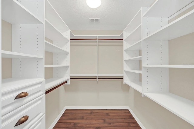 walk in closet featuring hardwood / wood-style flooring