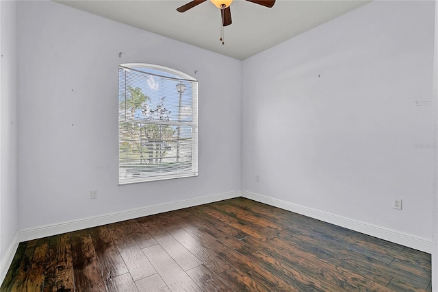 spare room featuring ceiling fan and dark hardwood / wood-style flooring