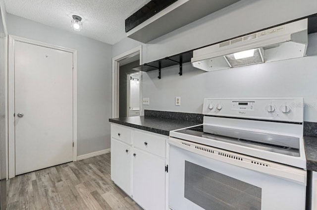 kitchen featuring white cabinetry, light wood-type flooring, white electric range, and a textured ceiling