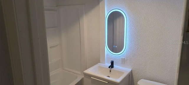 bathroom with toilet and vanity