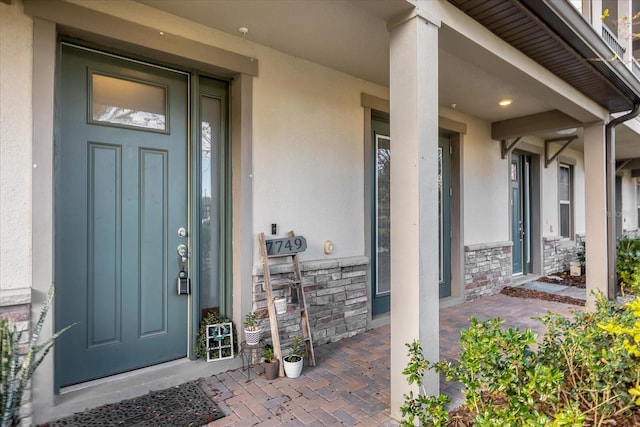 doorway to property with covered porch