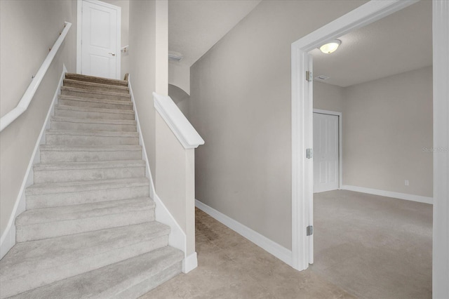 stairs with carpet flooring