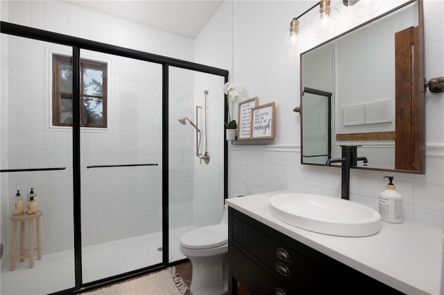 bathroom featuring tasteful backsplash, walk in shower, vanity, tile walls, and toilet