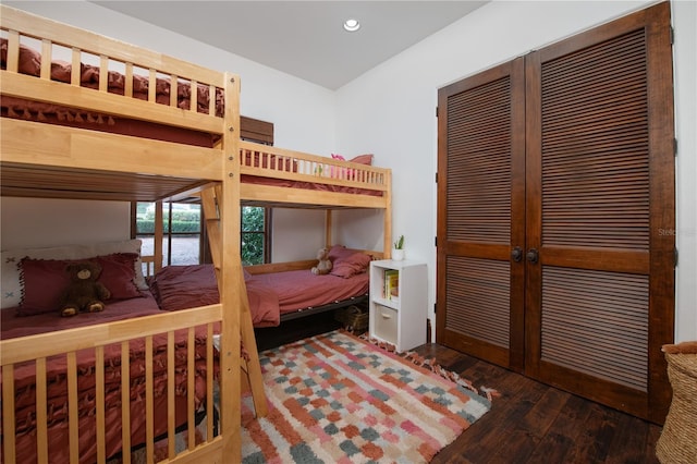 bedroom featuring dark hardwood / wood-style floors and a closet