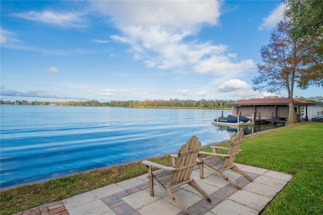 view of patio / terrace with a dock and a water view