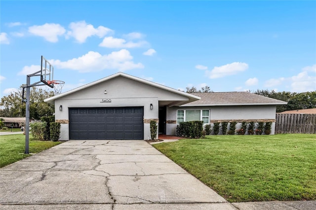 ranch-style home with a front lawn and a garage