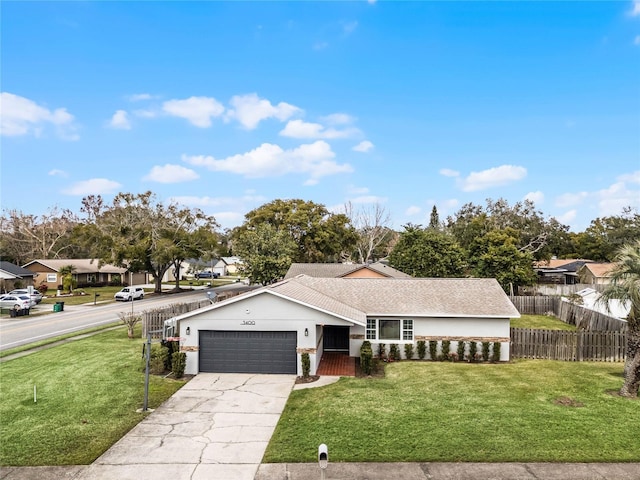 view of front facade with a garage and a front lawn