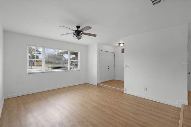 spare room with light hardwood / wood-style floors and ceiling fan