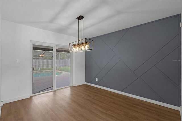 unfurnished dining area with wood-type flooring