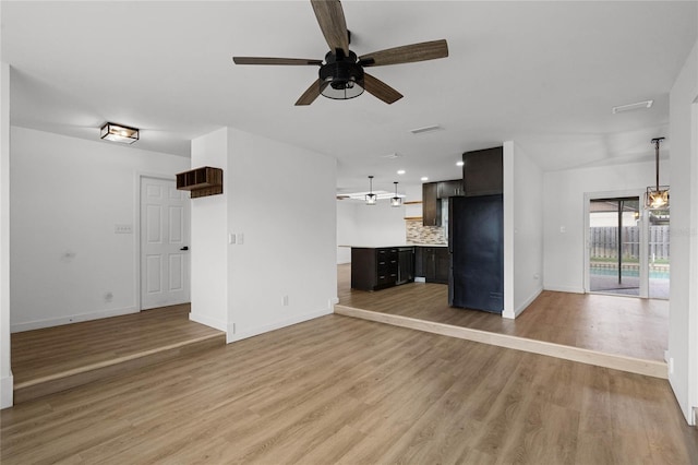 unfurnished living room with light hardwood / wood-style flooring and ceiling fan