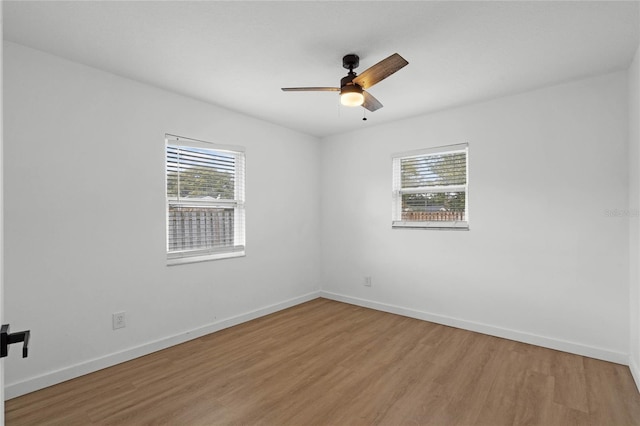 unfurnished room featuring ceiling fan and wood-type flooring