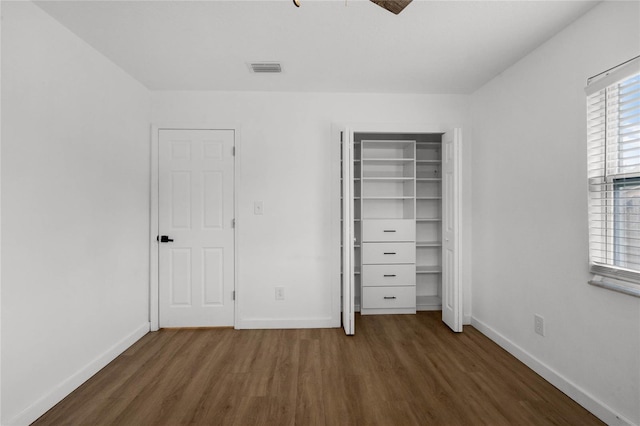 unfurnished bedroom featuring dark hardwood / wood-style floors