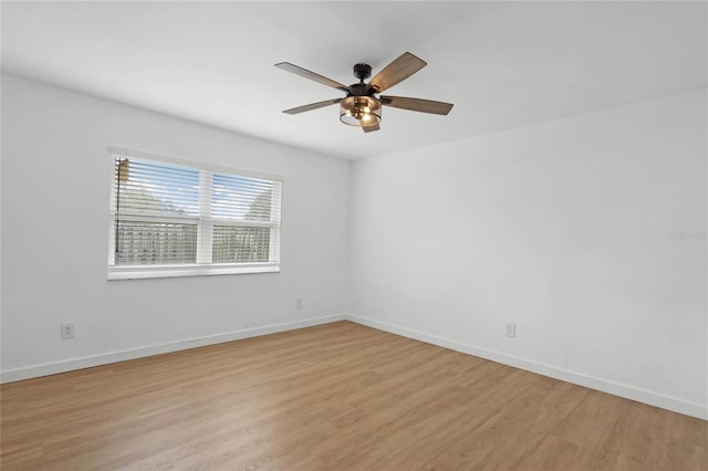 spare room featuring ceiling fan and light wood-type flooring