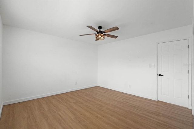 spare room featuring ceiling fan and wood-type flooring