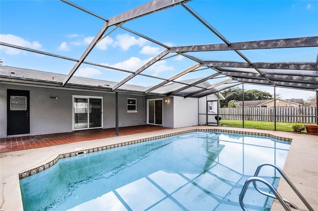 view of pool featuring a lanai and a patio area