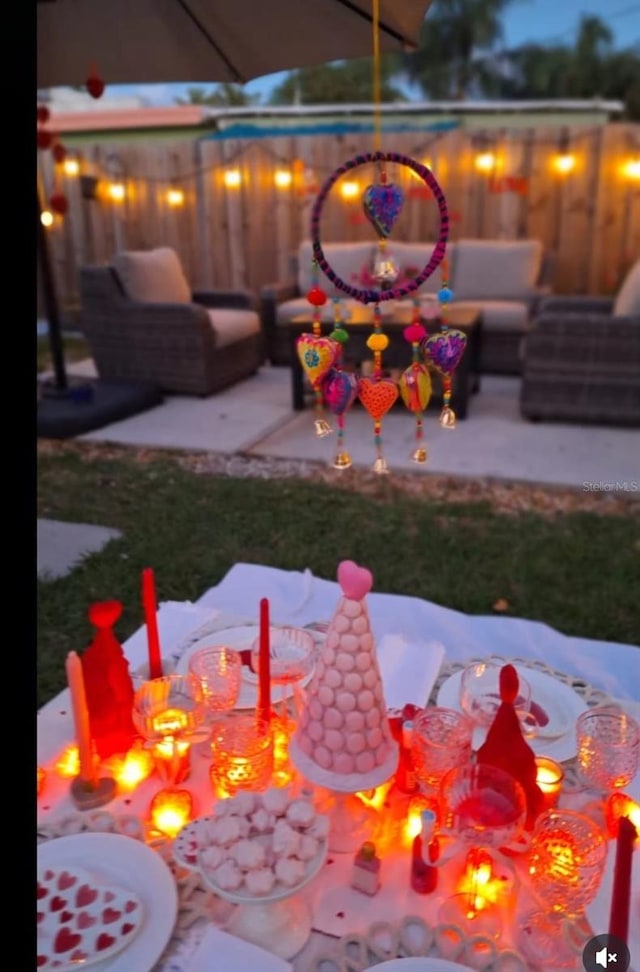 view of yard featuring a patio area and an outdoor living space with a fire pit