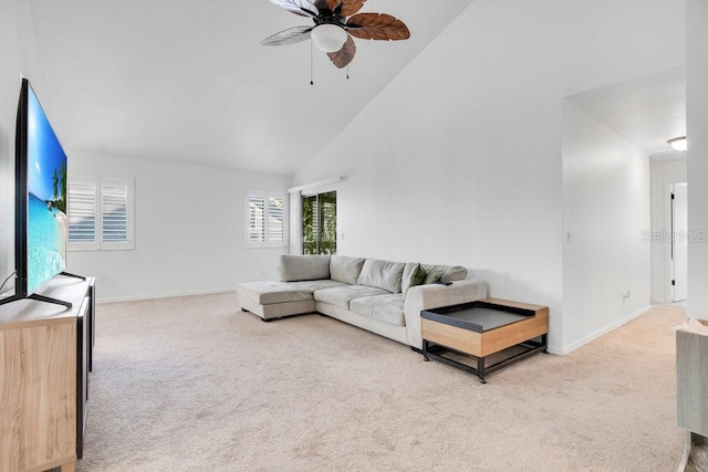 carpeted living area featuring high vaulted ceiling, a ceiling fan, and baseboards