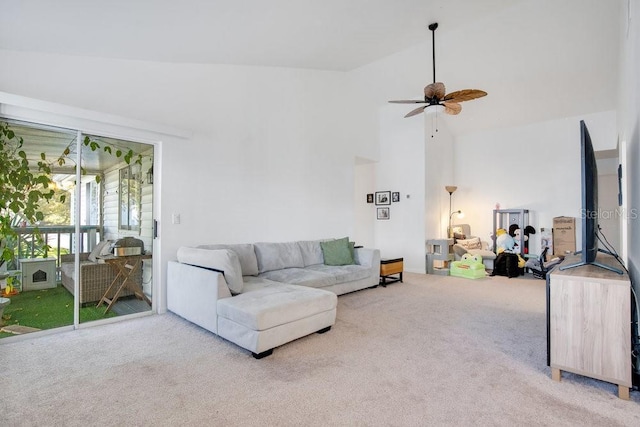 living room featuring ceiling fan, carpet floors, and high vaulted ceiling