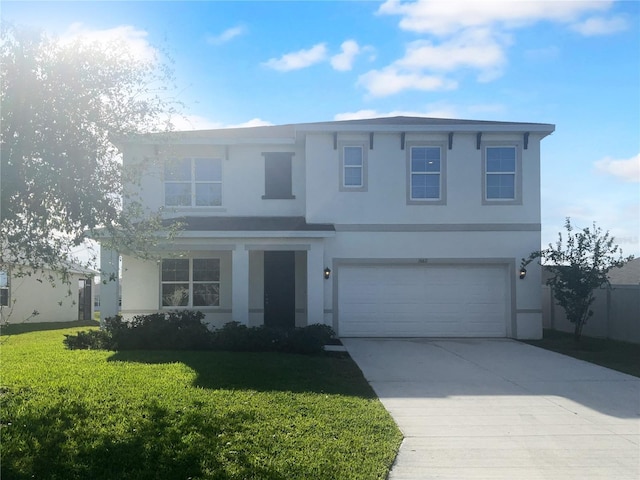 front of property with a front yard and a garage