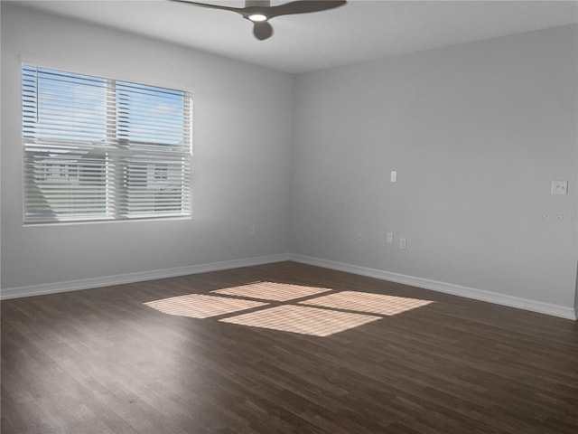 unfurnished room featuring dark hardwood / wood-style flooring and ceiling fan