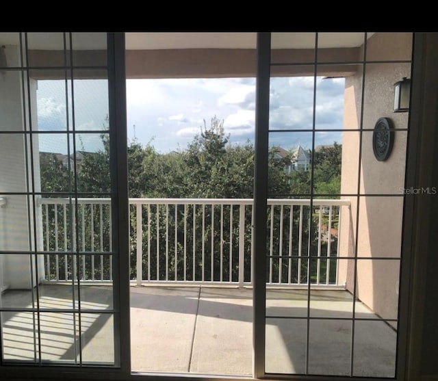 doorway to outside featuring plenty of natural light