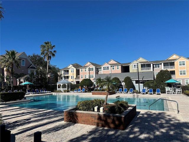 view of pool featuring a gazebo and a patio area