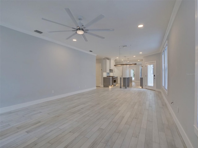 unfurnished living room featuring ceiling fan, light wood-type flooring, and crown molding