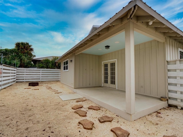 rear view of house with french doors and a patio