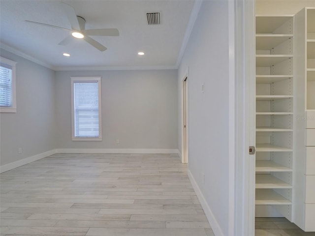 unfurnished room with light wood-type flooring, ceiling fan, and ornamental molding