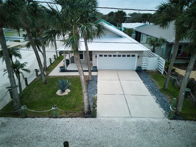 view of front of home with a garage and a front yard