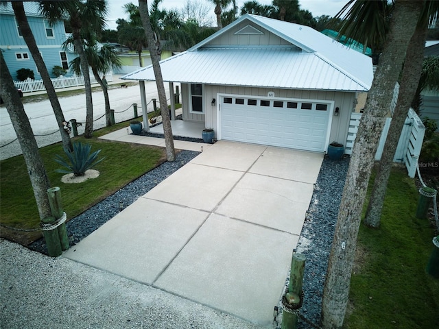 view of front of house featuring a front yard and a garage