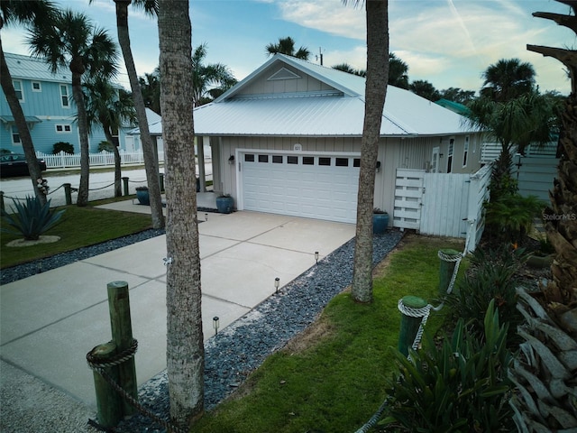 view of home's exterior featuring a garage and a yard