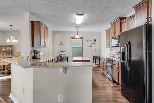 kitchen with a kitchen breakfast bar, electric stove, a chandelier, kitchen peninsula, and black fridge