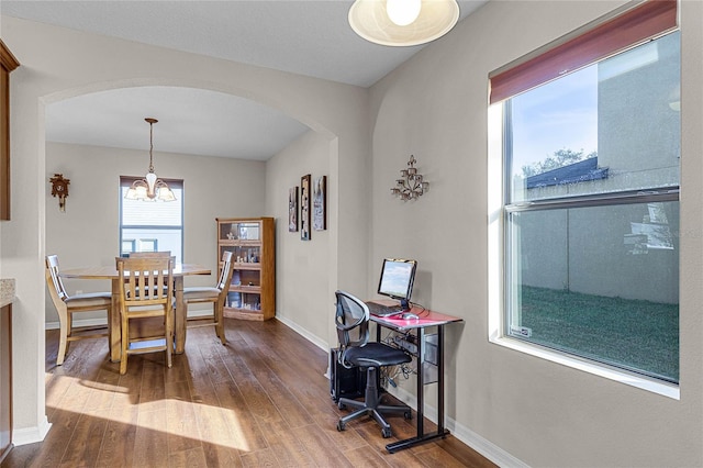 dining room with a chandelier and hardwood / wood-style floors