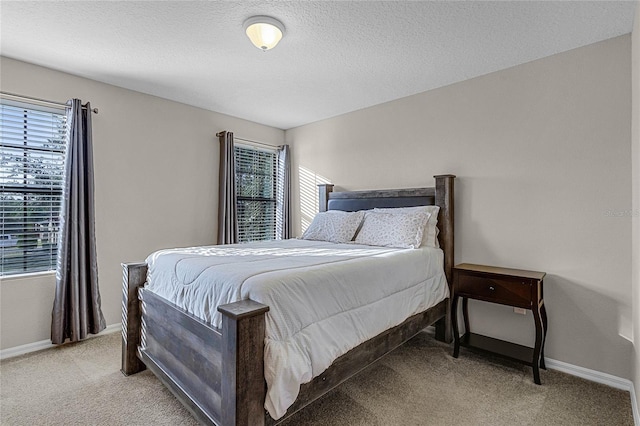 carpeted bedroom with a textured ceiling