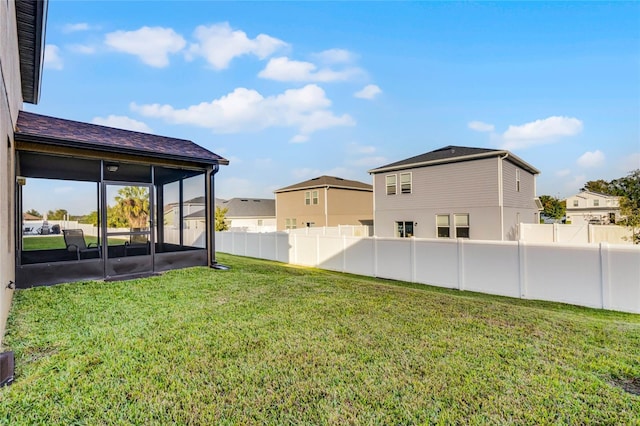 view of yard with a sunroom