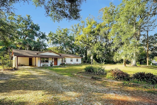 ranch-style home with a front yard