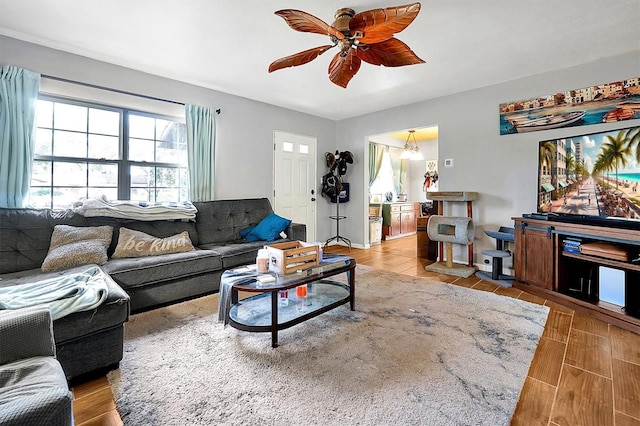 living room featuring light wood-type flooring and ceiling fan