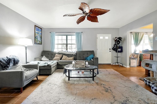 living room featuring hardwood / wood-style flooring and ceiling fan